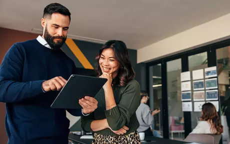 couple looking at tablet