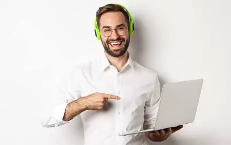 man pointing to laptop