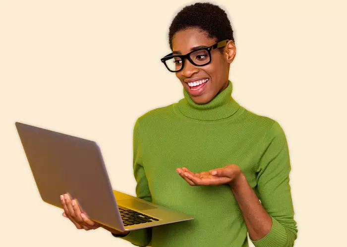 Woman with glasses holding laptop